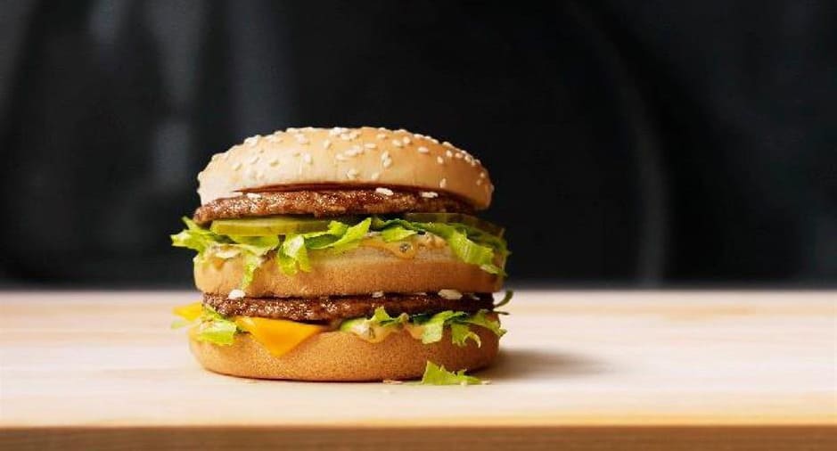 Identify the titan of patties: which industry giant serves up this iconic double-decker?